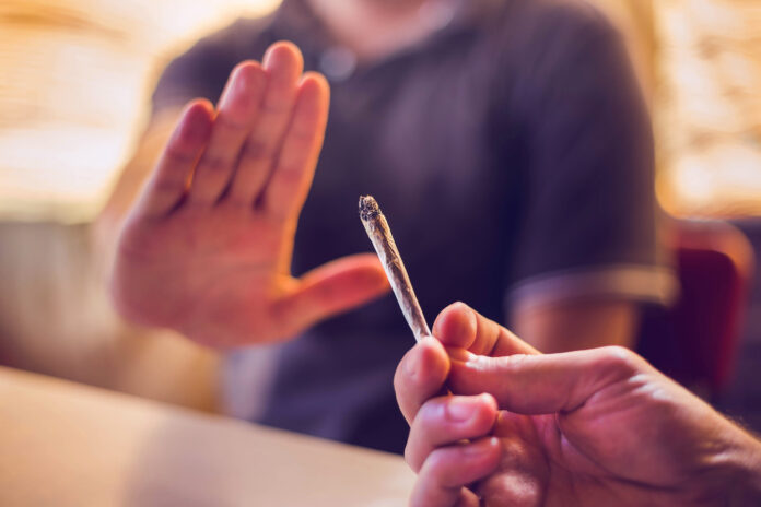 Man refusing a joint